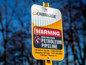 A signpost marks the presence of Enbridge's Line 5 pipeline, which Michigan Governor Gretchen Whitmer ordered shut down by May 12.