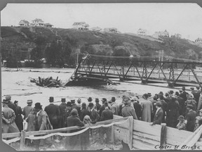 Calgary's waterways have always intertwined with its history. Here, Calgarians survey the Bow River and damage caused by major flooding in 1915, which destroyed the Centre Street bridge. Calgary Herald archives.