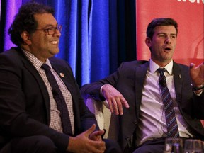 Calgary Mayor Naheed Nenshi (left) and Edmonton Mayor Don Iveson speak during the Mayors' Forum in Edmonton, Alberta on Wednesday, December 7, 2016.