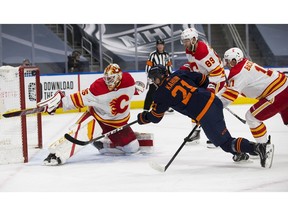 Edmonton Oilers' Dominik Kahun can't get the puck past Calgary Flames goalie Jacob Markstrom (25) during first-period NHL action on Saturday, May 1, 2021 in Edmonton. But Kahun and the OIlers wound up winning the game. Greg Southam/Postmedia