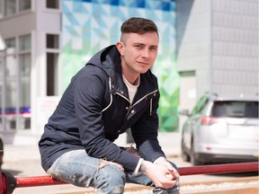 Rhys Farrell in front of his mural at the Avli on Atlantic condo development in Inglewood.