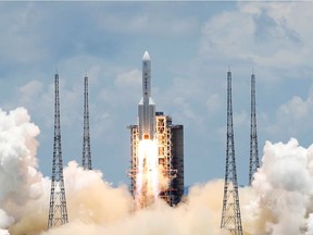 FILE PHOTO: The Long March 5 Y-4 rocket, carrying an unmanned Mars probe of the Tianwen-1 mission, takes off from Wenchang Space Launch Center in Wenchang, Hainan Province, China July 23, 2020. REUTERS/Carlos Garcia Rawlins/File Photo ORG XMIT: FW1