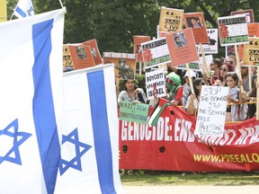 The Calgary Jewish Federation prays for peaceful discussion in Canada of the current Israel-Palestinian conflict. The complex geopolitical situation has attracted demonstrators across the country in recent years, including the last few weeks. 
Thousands of Palestinian and Israeli supporters clashed in Toronto in 2014, in this file photo.