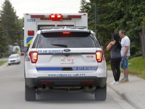 EMS and bylaw at scene of a dog bite at 15th Avenue and 39th Street S.W. after two people were attacked by a pitbull in Calgary on Sunday, June 6, 2021.