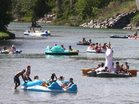 Calgarians float on the Elbow River.