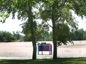 An empty Sikome Lake is shown in Fish Creek Park in Calgary Wednesday, June 23, 2021. The popular recreation area won't be open for the 2021 summer season.