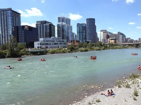 Paddlers, rafters and sun worshippers relax near St. Patrick’s Island in Calgary on Sunday, June 27, 2021.