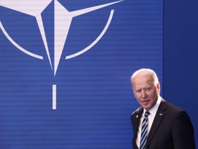 U.S. President Joe Biden arrives to pose with NATO Secretary General Jens Stoltenberg during the NATO summit at the Alliance's headquarters, in Brussels, Belgium, June 14, 2021.
