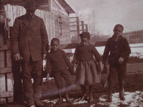 John Ware and three of his children, early 20th century, visiting at the Willans ranch near Millarville. Photo courtesy Elizabeth Longstaff.
