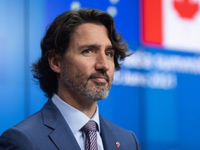 Prime Minister Justin Trudeau pauses during a news conference following a European Union and Canada summit in Brussels, Belgium, on June 15, 2021.