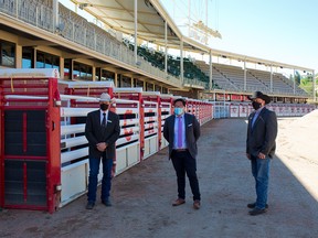 Dana Peers, Interim CEO, Calgary Stampede, Dr. Jia Hu, public health physician, advisor to the Calgary Stampede and Steve McDonough, President & Chairman of the Board, Calgary Stampede were photographed in the rodeo infield area after an update on safety measures for this year's Stampede on Monday, June 14, 2021.