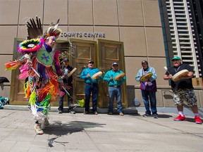 Kyle Young Pine dances with drummers as supporters gathered in memory of Kristian Ayoungman White outside the Calgary Court Centre on Tuesday, June 15, 2021. Brandon Giffen is charged with first-degree murder in Ayoungman White’s death on a rural road near Strathmore in 2019. Giffen’s trial continued on Tuesday.