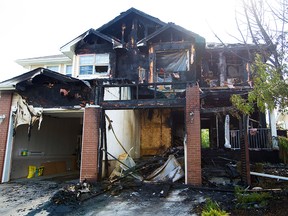 A home in the 200 block of Cranston Drive S.E. in Calgary was badly damaged in an early morning fire on Sunday, June 20, 2021.