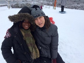 Atosha Ngage (left) and Karina Reid went on a trip to see snow as shown in this undated handout image. Ngage, a refugee from the Democratic Republic of Congo, had just arrived in Canada and it was her first time to experience winter.