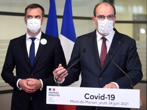 French Prime Minister Jean Castex (R), next to French Health Minister Olivier Veran, holds a press conference during a visit in Mont-de-Marsan, southwestern France, on June 24, 2021, to observe the sanitary situation due to the Covid-19 pandemic.