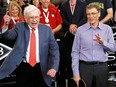 Berkshire Hathaway CEO Warren Buffett, left, plays table tennis with Bill Gates at the annual shareholders meeting in Omaha in 2013. Buffett said Wednesday he is resigning as a trustee of the Bill and Melinda Gates Foundation.