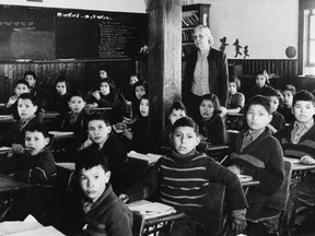 Indigenous students sit in a classroom at Lac La Ronge (All Saints) Residential School in La Ronge, Sask., circa 1950.