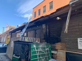 The roof of a three-storey commercial building was damaged after a dumpster in the alley somehow caught fire in the early morning hours of Thursday, June 3.