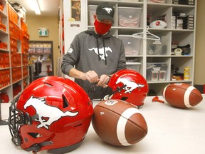 Gord Taillefer, assistant equipment manager for the Calgary Stampeders, gets the locker room ready at McMahon Stadium on Monday, June 14, 2021.