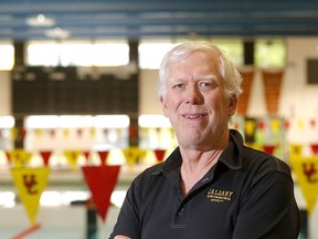 Calgary Dinos swim coach Mike Blondal has his charges focused on meeting the Olympic standard this weekend. But it won't be easy.