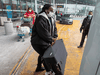 International air travellers load their luggage onto a shuttle bus to take them to one of the quarantine hotels Monday, February 22, 2021 in Montreal.