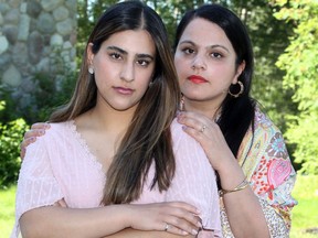 UCP MLA and community and social services minister Rajan Sawhney and her 25-year old daughter Raman Sawhney pose for a photo outside their Calgary home. Raman was the victim of a racist attack in downtown Calgary Friday morning.