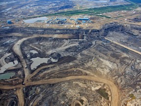 An aerial view of Syncrude's Aurora North oilsands mine near Fort McKay, Alta. on June 18, 2013. (Ryan Jackson / Edmonton Journal)