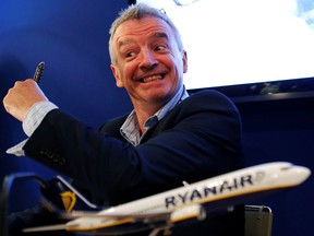 FILE PHOTO: Ryanair Chief Executive Michael O'Leary gestures during a signing ceremony at the 50th Paris Air Show, at the Le Bourget airport near Paris, June 19, 2013.