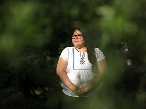 Melissa Mbarki, policy analyst at the Macdonald-Laurier Institute, outside her home in Edmonton on Thursday, June 3, 2021.