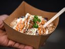 Pictured is Jerk Chicken Rice Bowl from Jamaican Mi Juicy at Calgary Stampede's midway on Sunday, July 11, 2021. Azin Ghaffari/Postmedia