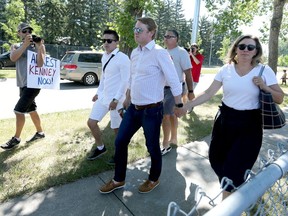 Alberta Health Minister Tyler Shandro and his family arrive and were greeted by hecklers and protests at a Canada Day event in Parkland in southeast Calgary on Thursday, July 1, 2021.