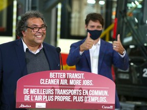 Mayor Naheed Nenshi speaks and Prime Minister Justin Trudeau gestures during a visit to Calgary on Wednesday, July 7, 2021. He and officials announced the Green Line LRT will go ahead.