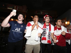 Soccer fans Khalil Bouilouta, Islam Mahmoud, Tom Sherwood and Ahmad Chybli watch the penalty kicks in the England v Italy Euro 2020 final at the Ship and Anchor in Downtown Calgary Sunday, July 11, 2021. Italy beat England in penalties to take home the Euro 2020 title.