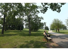 Beverly Sandalack, a University of Calgary professor in the school of architecture, planning and landscape, enjoys the greenery in Richmond Green park in southwest Calgary on Thursday, July 15, 2021.
