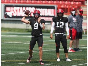 Dakota Prukop throws as fellow quarterback Jake Maier looks on during Calgary Stampeders training camp at McMahon Stadium in Calgary on Saturday, July 24, 2021.