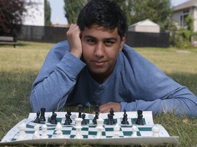 Chess player Muhammad Saim, 16, president of Checkmate Foundation, poses near his northwest Calgary home Sunday, July 25, 2021.