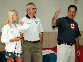 Pic of new national swim coach Shauna Nolden (L), Head Coach Dave Johnson (R) and an unidentified coach at Pan Am Pool in Winnipeg.