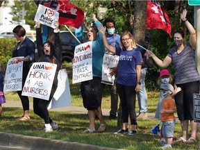 About 100 nurses and supporters staged a protest rally outside the Sturgeon Community Hospital in St. Albert on Monday, July 26, 2021, to protest proposed wage rollbacks and other changes in a new collective agreement.