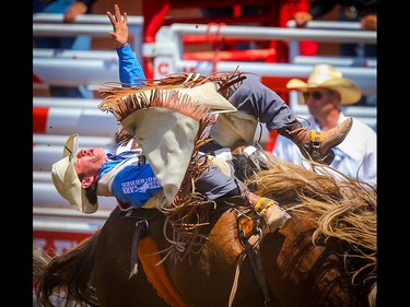 Cole Franks of Clarendon, TX, on a horse called Showboy during the bareback event at the Calgary Stampede rodeo on Monday, July 12, 2021. Al Charest / Postmedia