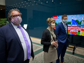 Calgary Mayor Naheed Nenchi and Councillors Jyoti Gondek and Jeff Davison were photographed following council voting to rescind the mandatory masking bylaw in the city. Mandatory masking for transit and inside city owned and operated facilities will remain for the time being. Council voted on Monday, July 5, 2021.