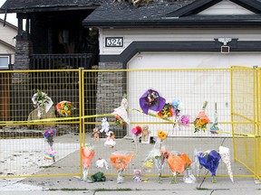 A growing memorial at the fatal house fire in Chestermere Lake where seven people died. Photo taken on Sunday, July 4, 2021.