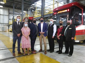 Prime Minister Justin Trudeau, centre, poses with Calgary city councillors and then-mayor Naheed Nenshi on July 7, 2021.