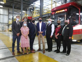 Prime Minister Justin Trudeau (C) poses with Calgary city councillors and Mayor Naheed Nenshi during a visit to Calgary on Wednesday, July 7, 2021. He and officials announced the Green Line LRT will go ahead.
