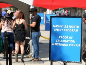 Guests provide proof of their COVID-19 vaccinations at Nashville North at the Calgary Stampede on Sunday, July 11, 2021.