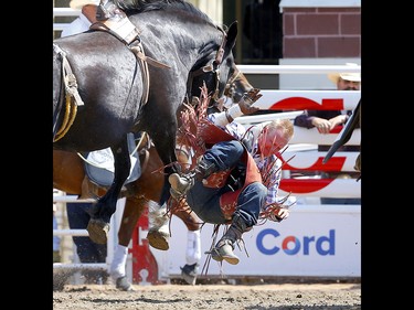 Logan Corbett from Nashville, TN, riding Two Times The Money during the Bareback event on day 4 of the 2021 Calgary Stampede rodeo on Monday, July 12, 2021. Darren Makowichuk/Postmedia
