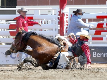 Sage Newman from Melstonr, MT, riding Direct Delivery during the Saddle Bronc event on day 4 of the 2021 Calgary Stampede rodeo on Monday, July 12, 2021. Darren Makowichuk/Postmedia
