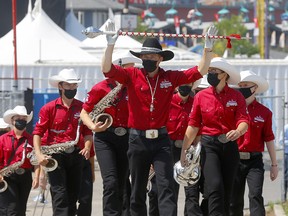 The Calgary Stampede Showband gets ready to perform at the rodeo during the 2021 Calgary Stampede on Tuesday, July 13, 2021.