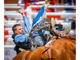 Orin Larsen, of Inglis, Man., on a horse called North Country during the bareback event at the Calgary Stampede rodeo in this photo from July 13, 2021.