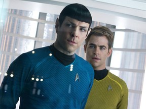 This undated publicity film image released by Paramount Pictures shows, Zachary Quinto, left, as Spock and Chris Pine as Kirk in a scene in the movie, "Star Trek Into Darkness," from Paramount Pictures and Skydance Productions.