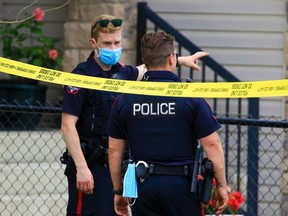 Calgary police contain the scene of a fatal shooting in the 500 block of Cresthaven Place S.W. on Wednesday, July 7, 2021.